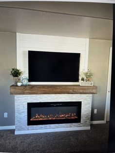 a fireplace with a flat screen tv above it