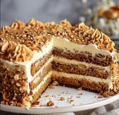 a large layered cake with nuts on top