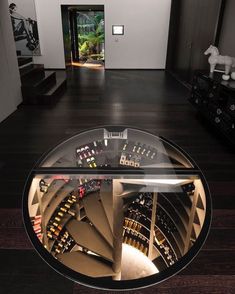 a circular glass table in the middle of a room