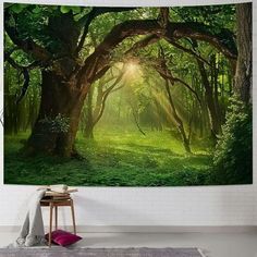 an image of a forest with sunlight coming through the trees tapestry wall hanging art print