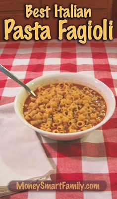 a white bowl filled with pasta on top of a red and white checkered table cloth