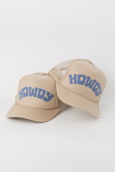 Classic Howdy trucker hat. Screen printed "Howdy" art on the front foam panel. High crown fit with adjustable snapback closure. Features- Puff "Howdy" Screenprint- Adjustable Fit- High Crown Mesh Trucker Content + Care- 100% Polyester Front; 100% Polyester Mesh Back- Spot clean- Domestic Howdy Hat, Trucker Hat With Letter Print And Flat Bill, Adjustable Trucker Hat With Letter Print And Flat Brim, Adjustable Snapback Trucker Hat With Letter Print, Adjustable Trucker Hat With Graphic Print And Curved Brim, One Size Letter Print Trucker Snapback Hat, Flat Brim Trucker Hat With Letter Print, Graphic Print Trucker Hat With Flat Bill, Graphic Print Trucker Hat With Curved Brim