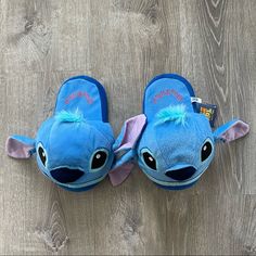 the slippers are blue with pink ears