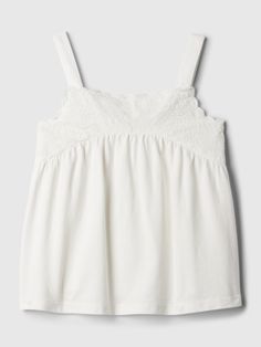 Soft cotton tank top.  Square neck.  Tank straps.  Lace detailing at chest.  Straight, easy fit.  Hits at the hip.  Sizes range from baby to toddler. Cute White Tops Summer, Cotton Tank Top With Lace Trim, Cotton Tank Top With Lace Trim And Spaghetti Straps, Summer Cotton Lace Top Camisole, Summer Cotton Camisole With Lace Top, Gap Cami Tops For Summer, Gap Cotton Tank Top For Summer, Gap Cami Tops For Spring, Gap Cotton Tops For Summer