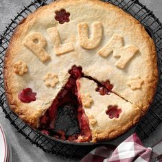 a pie with the word plum written on it