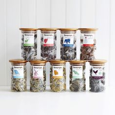 six jars filled with different types of spices