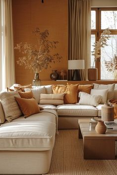 a living room filled with lots of furniture next to a large window covered in curtains