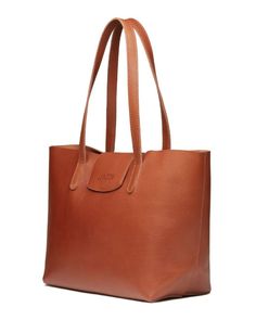 Step out in style with Lyndon's Leather Classic Tote. This Classy and Minimalist Tote is meticulously crafted from premium full-grain leather, boasting a smooth matte and pebbled finish that speaks of timeless elegance. The tote comes with a secure magnet top, an unlined suede interior, a keyholder, and a zip pocket, making it as practical as it is stylish. Classic Cognac Shoulder Bag In Vegetable Tanned Leather, Classic Cognac Vegetable Tanned Leather Shoulder Bag, Timeless Leather Shoulder Bag For Everyday, Everyday Timeless Leather Shoulder Bag, Classic Shoulder Bag In Pebbled Leather With Leather Lining, Classic Calf Leather Shoulder Bag For Daily Use, Everyday Calf Leather Shoulder Bag With Magnetic Closure, Classic Everyday Calf Leather Shoulder Bag, Leather Bags For Work