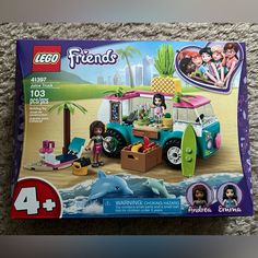 the lego friends set is in its box on the carpeted floor with it's contents