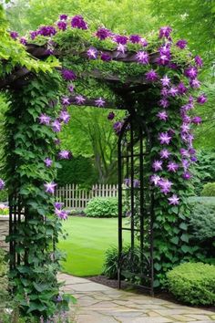 an arbor with purple flowers on it