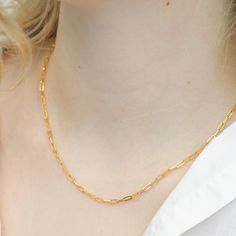 This timeless chain link necklace is sure to become a go-to jewelry staple when you want to add a touch of glam to your look. Plated in 16K genuine gold or silver, this delicate paper clip chain necklace is stunningly designed, and is perfect for anyone to wear. Wear this necklace alone or pair it with other dainty necklaces and pendants for a layered look. Materials & Dimensions METAL: 16k genuine gold or silver-plated brass SIZE: 17" / 19'' chain; Chain width: 2mm CLOSURE: Lobster claw Avoid c Minimalist Paperclip Chain Necklace As Gift, Minimalist Paperclip Chain Necklace For Gift, Minimalist Paperclip Chain Necklace Gift, Elegant Gold Plated Paperclip Chain Bracelet, Figaro Chain Necklace With Rectangular Links As Gift, Paperclip Necklace With Delicate Chain For Gift, Gift Figaro Chain Necklace With Rectangular Links, Gold Plated Chain Necklace With Delicate Rectangular Links, Dainty Paperclip Chain Necklace For Gift