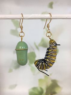 Kia ora! I ship from beautiful little Nu Tireni/New Zealand, please take the shipping times into account before purchasing. I do recommend using the tracked shipping option as your parcel has a way to fly! Thanks for stopping by - Lisa xx  Hand painted and crafted Monarch caterpillar and emerging chrysalis earrings. Strikingly beautiful, these earrings are hand sculpted  then painted. They are nice and light. You'll be sure to get comments when you wear these! As they are handmade, no two will be identical. Choose either silver, antique bronze or gold coloured ear wires. -------------------------------------------------------------------------------------------------------------------------- *INTERNATIONAL SHIPPING* -------------------------------------------------------------------------- Caterpillar Earrings, Bug Earrings, Monarch Caterpillar, Diy Earrings Polymer Clay, Lampwork Jewelry, Spring Earrings, Insect Art, Jewelry Accessories Ideas, Butterfly Jewelry