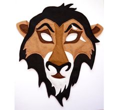 a lion mask is shown on a white background with black and brown details, including the eyes