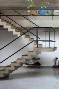 a living room filled with furniture and a stair case