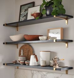 some shelves with bowls and cups on them