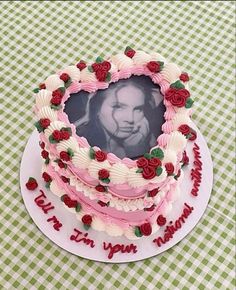 a heart shaped cake with roses on it