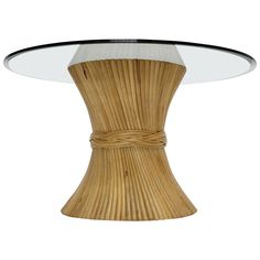 a round glass table with a wooden base and rope wrapped around the top on an isolated white background