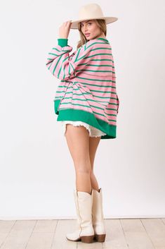 Get cozy and stylish with our Striped Loose Fit Sweatshirt! This oversized sweatshirt features a fun pink and green striped design and is made of waffle knit material for extra comfort. With a high low hem and button closures, it's the perfect combination of fashion and function. 😍 - Fits very oversized - Round neckline - Long sleeves -Button-down closure - Raw seam - High-low hem -95% Polyester 5% Spandex Casual Spring Sweater With Striped Hem, Trendy Oversized Striped Sweater, Casual Pink Tops With Contrast Stripes, Relaxed Fit Sweater With Contrast Stripes For Spring, Oversized Top With Striped Hem, Oversized Tops With Striped Hem For Spring, Spring Relaxed Fit Contrast Stripes Sweater, Spring Contrast Stripes Relaxed Fit Sweater, Spring Contrast Stripes Relaxed Sweater