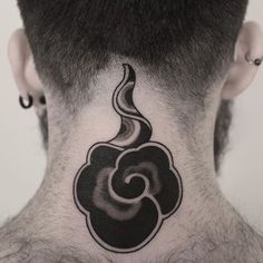 a man with a black and white tattoo on his neck