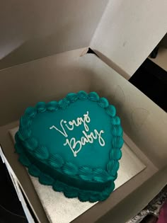 a cake in a box with the words give baby written on it's side