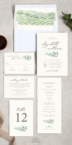 the wedding stationery is laid out on top of an envelope