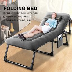 a woman is laying on a folding bed