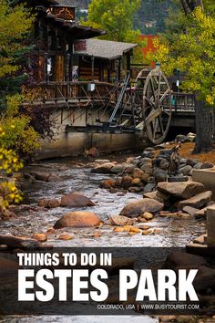 a river running through a forest filled with lots of trees and rocks next to a building