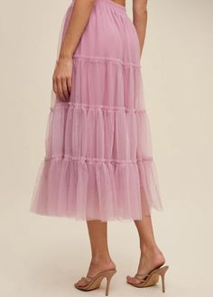 Mauve tiered mesh skirt with elastic waistband and raw hem. Self and Lining 100% Polyester Hand wash in cold. Aprox. measurements in inches: S:Length of self-33, length of lining-28 |Waist-27 M:Length of self-34, length of lining-29 |Waist-29 L:Length of self-34, length of lining-29 |Waist-31 modest dresses, modest dress, modest midi, modest maxi, modest fashion, modest trendy dresses, modest boutique, modest attire, modest clothing, modest tops, modest skirts, modest shop Feminine Tiered Bottoms With Layered Hem, Tiered Layered Hem Feminine Bottoms, Feminine Layered Hem Tiered Skirt, Feminine Layered Tiered Skirt, Feminine Tiered Ruffled Skirt, Pink Tiered Bottoms With Layered Hem, Feminine Tiered Skirt With Layered Hem, Flowy Tulle Maxi Skirt For Spring, Tulle Maxi Skirt With Ruffled Details