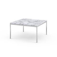 a white marble top coffee table with metal legs