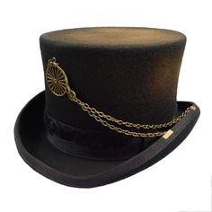 Black Merino wool felt top hat with brown-gold dusting. Black grosgrain ribbon band with aged, worn look. Wheel accent on front with double gold chain clipped to be brim. Crown 5" high. 2" wide rolled and ribbon bound brim. Lined with red satin. Leather sweatband. 100% Australian Merino wool Lining 100% polyester. Punk Hats, Top Hat Costume, Steampunk Top, Steampunk Stuff, Tuck Everlasting, Steampunk Top Hat, Hat Aesthetic, Steampunk Hat, Types Of Hats