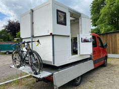 a bike is attached to the back of a truck