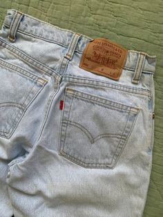 Vintage Levi's 550 light wash jeans from the 1990s with tapered legs, relaxed fit and a high waist. In overall great condition, no flaws to note. Fits best a 24 in to 25 in waist. Measured flat: Waist 12" - 12.5" pulled Rise 10" Hips 18" Inseam 31.5" Leg opening 5.5" PLEASE READ! *MEASUREMENTS* All items are measured while laying flat and unstretched. For clothing: chest, waist, hip and thigh measurements should be multiplied by two. All measurements are in inches. *VINTAGE CONDITION* Vintage goods may show signs of wear and age. We always indicate and/or show in pictures any major flaws or blemishes, but will not always mention small flaws, such as pinpoint sized spots or holes. If you are concerned about a particular item's condition, please message us. All of our pieces are pre-owned. W Levis Vintage, Levis 550, Light Wash Jeans, Wash Jeans, Vintage Levis, Tapered Legs, 12 12, Denim Pants, Levi's