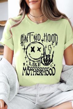 Mom Ain't No Hood Like Motherhood Funny Mothers Day Graphic T Shirts.Unisex Crew Neck Short Sleeve Tees.Crafted from premium materials, tailored to your lifestyle, ensuring a comfortable fit for any occasion.Family Group Uniforms Birthday Party Gift Concert Festival Events.High Quality Direct To Film Printed Graphic Design.100%COTTON,HEATHER(52%COTTON,48%POLY),ATH.HEATHER,BLACK HEATHER(90%COTTON,10%POLY)NICARAGUAMade In: Nicaragua Motherhood Silhouette, Mother’s Day Shirts, Bar Shirts, Mothers Day Graphic, Occasional Outfits, No Hood Like Motherhood, Shirt Outfit Ideas, Cricut Inspiration, Mom Graphic Tees