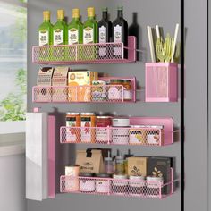 a pink shelf filled with lots of different items