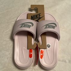 Nike Victori One Slides. Size 7, In Barely Rose/Metallic Silver. New With Tags In Original Box. Nike Victori One Slides, Nike Slides, Shoes Nike, Women's Shoes Sandals, Nike Shoes, Metallic Silver, Nike Women, Slides, Shoes Sandals