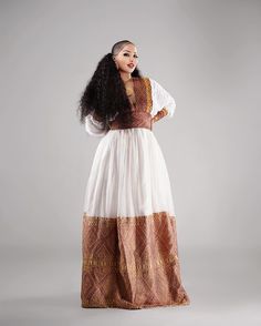 Beautiful Brown Habesha Dress Traditional Floor-length Maxi Dress For Transitional Season, Traditional Maxi Dress With Traditional Patterns For Festive Occasions, Traditional Maxi Dress For Eid, Ceremonial Maxi Dress With Traditional Patterns, Traditional Maxi Dress With Patterns For Eid, Traditional Maxi Dress With Traditional Patterns For Eid, Traditional Embroidered Maxi Dress, Traditional Long Dress With Traditional Patterns, Elegant Festival Maxi Dress With Traditional Patterns