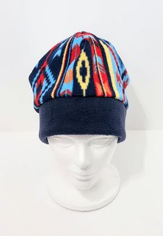 Southwest Print with Navy Blue Band, Adult Sizing Unique Fleece Hat, Nice Colors - Gift Giving ♥ Colors in the hat: Navy blue band, the top of the hat has various blues, red, yellow and orange.  *Colors may vary a little depending on the resolution of your computer monitor. In our screen the colors are brighter then they are.  *Print placement may vary since there is Multiple's. Has a double band along the bottom for extra warmth for your ears. Stitching is reinforced with over-lock stitching.  Ready to Ship: Fit's 23" to 23.5" diameter or Large Adult Size, 9 3/4" to 10" from top of hat to bottom.  Care instructions: Machine wash in cold water. Dry on low heat settings. Also, it will include care instructions. Would you like a fleece beanie in a different color or style? We will try very h Southwest Print, Fleece Hat, Knitting Books, Easy Sewing Patterns, Unisex Gifts, Skull Cap Beanie, Skull Cap, Vintage Sewing Patterns, Hat Designs