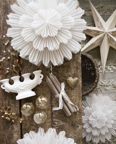 paper stars and other decorations on a table