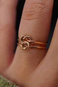 This double love-knot is the perfect gift! Made up of two individual rings that are permanently connected, this tied ring is a classic and gorgeous gift to symbolize your loved one. This listing is for ONE RING. Each ring is made from 14K GOLD FILL. Available only in the Thick (1mm) metal. Please note that the Open Knot Ring style has a slightly faceted or hammered finish. It is not completely smooth. Every piece is organic and unique — no two Hannah Naomi pieces are exactly alike.Hand-crafted t Double Knot, Knot Ring, Ring Style, One Ring, Gorgeous Gift, Cleaning Jewelry, Metal Jewelry, Fashion Rings, Gold Filled