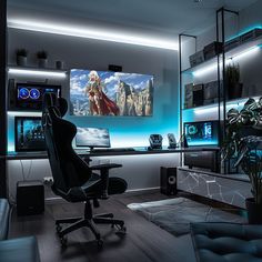 a gaming room with a large screen tv on the wall