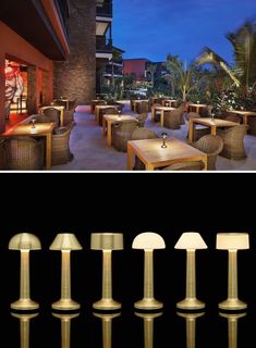 an outdoor dining area with tables, chairs and lamps on the outside patio at night