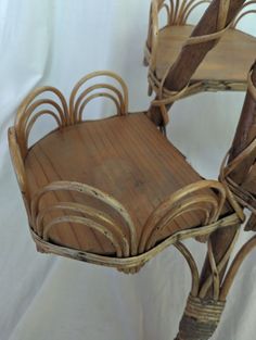 two chairs made out of wood and wicker