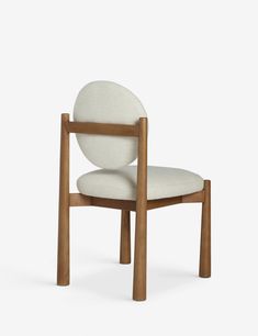 a wooden chair with a white upholstered seat