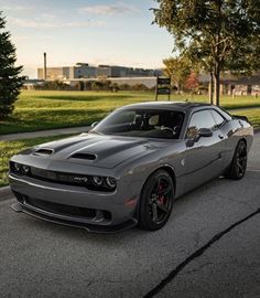 a gray sports car parked on the street