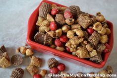 a red bowl filled with cereal and nuts