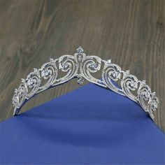 a tiara on top of a blue cloth