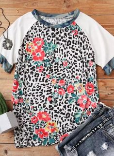 95% Polyester, 5% Spandex. Casual crew neck tee with leopard print and camo design, loose fit, soft material and ideal for most activities T Shirt Flowers, Leopard Print Shorts, Swimwear High Waisted, Trousers Jeans, Camo Designs, Cozy Tops, Travel Party, Womens Tops Summer, Tees For Women