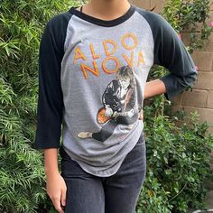 Aldo Nova 80's Rock Gray Heather & Black 3/4 Sleeve Crewneck T-Shirt. Soft Hand Feel Knit Fabric With Nicely Worn Down Washed Look. Bold Large Colorful Art At Front And Back Body. Original Vintage! Relaxed Tee Fit! Size M 28" Top To Bottom. 18 1/2" Under Arm. Model- Height:5’5”, Size: Xs-S Dm Me With Any Questions Next Day Shipping Aldo Nova, Large Colorful Art, Arm Model, Glam Metal, Crew Neck Tshirt, Soft Hand, Heather Black, Model Height, Dm Me