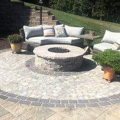 a fire pit sitting on top of a stone patio