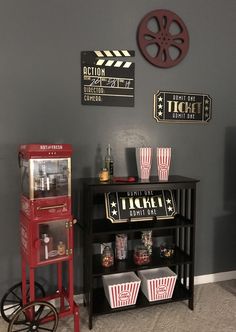 a movie themed room with popcorn buckets and signs